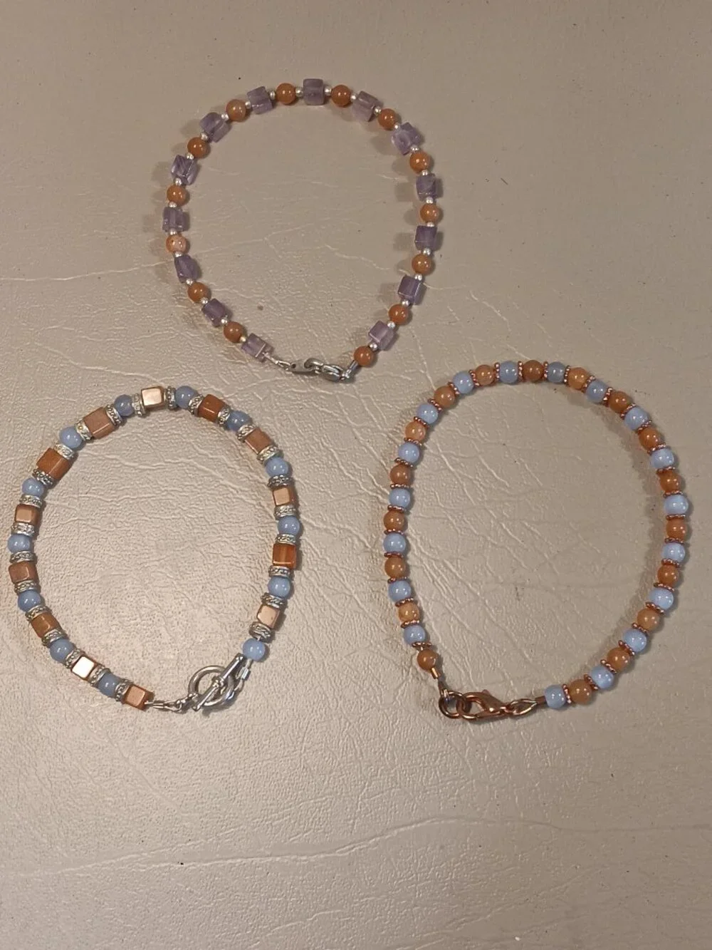Lot of 3 stone bead bracelets pale blue light orange purple tones